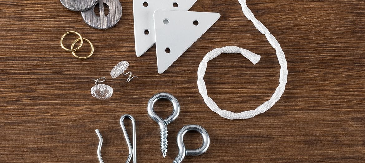 Various drapery hardware on a wooden background
