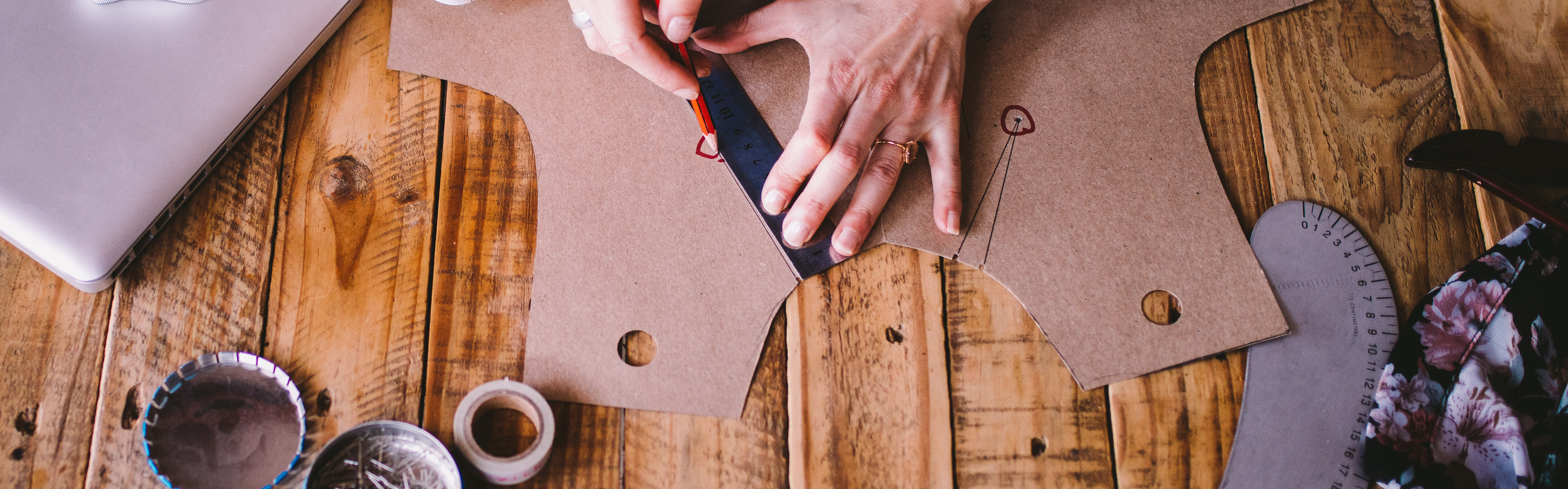 Hands Pattern Making Marking Tools on Wooden Table
